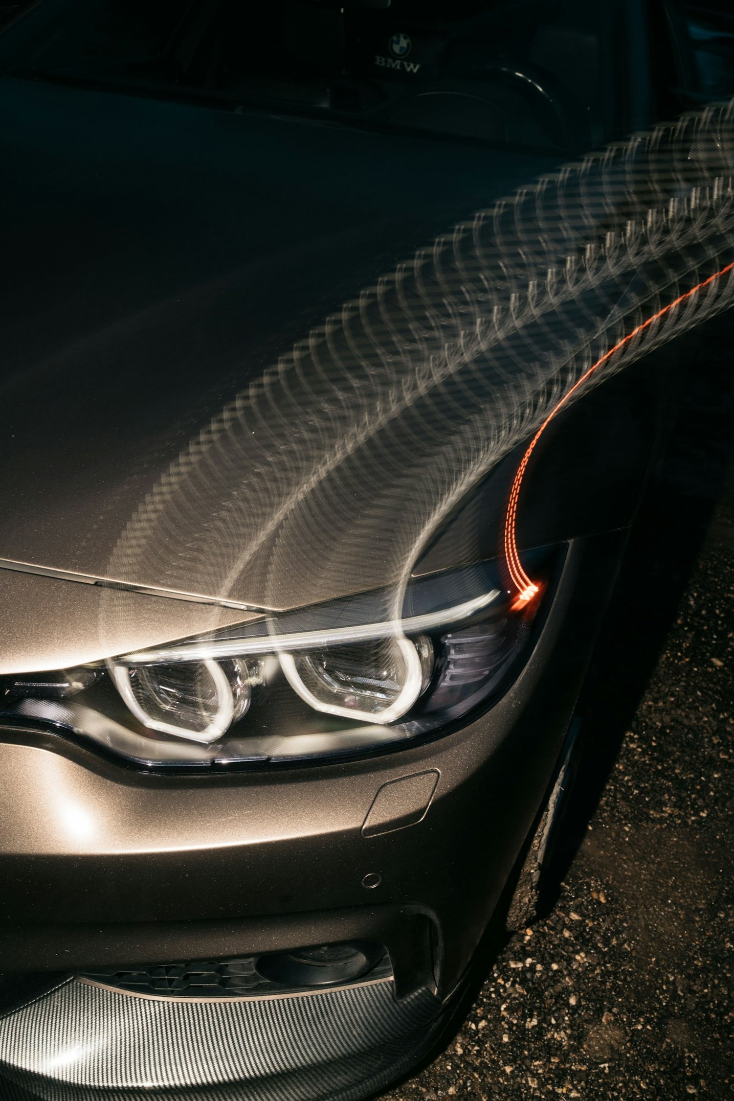 Editorial close-up of a headlight lens and its reflective housing